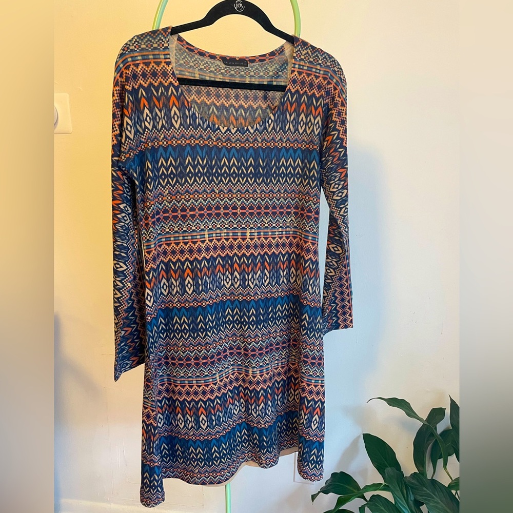 Mini dress with western 70's vibes. Light weight fabric lined. Size L.